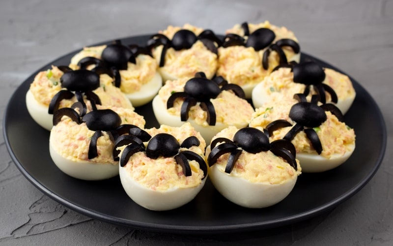 Spooky Halloween Deviled Eggs with Black Olive Spiders for Parties